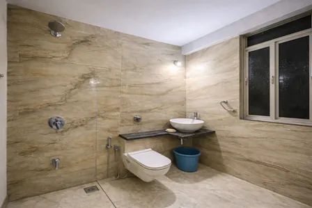 Hygienic attached bathroom with 24/7 hot water in our boys PG near Powai Lake