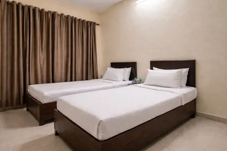 Fully furnished twin sharing PG in Chandivali near SM Shetty College with modern beds and air conditioning