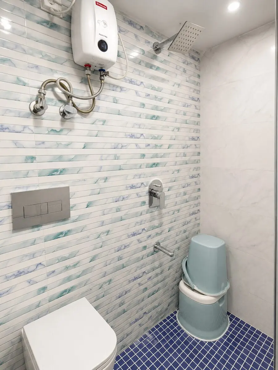 Modern washroom with geyser at Zest Stays PG in Goregaon West