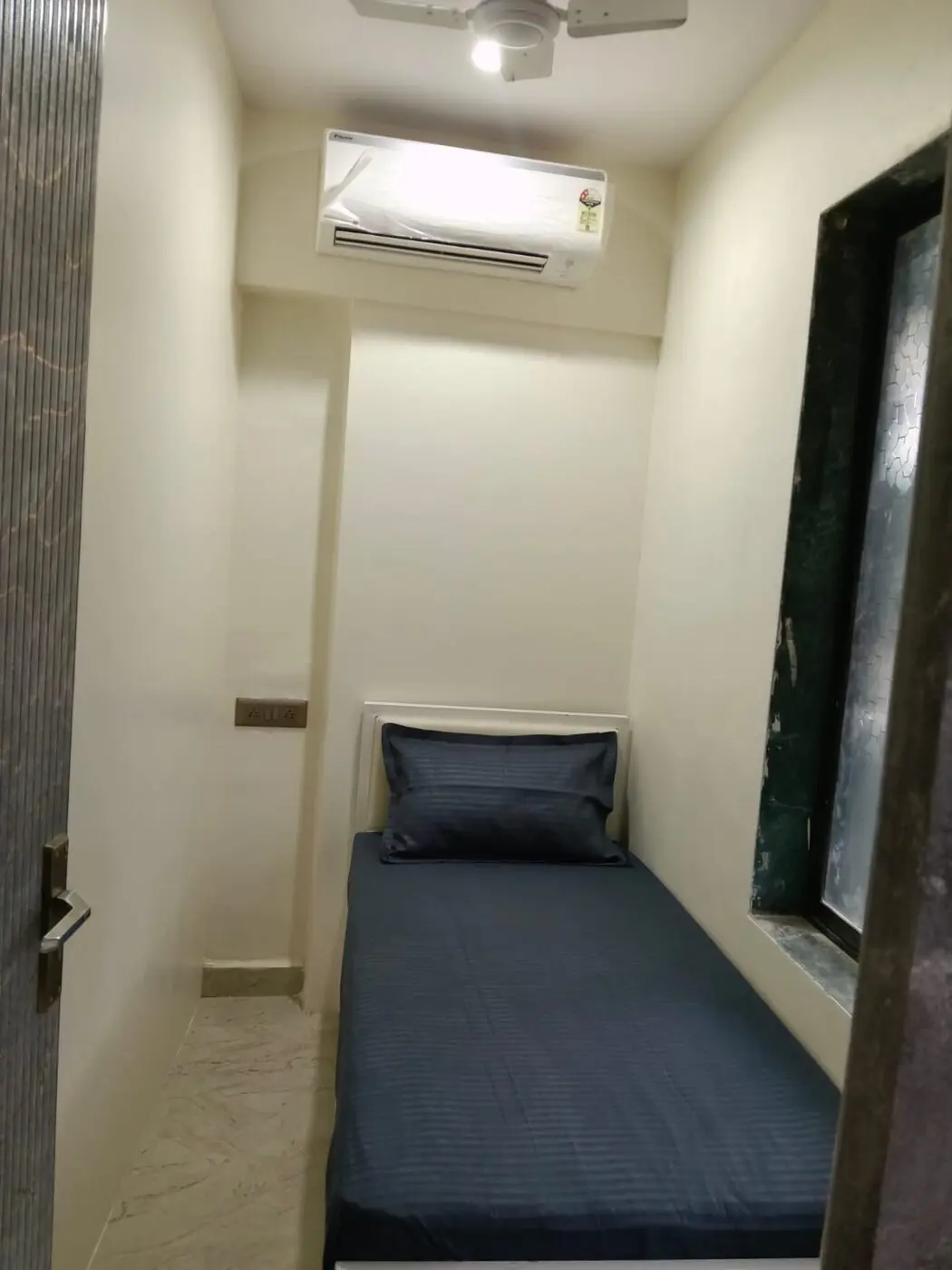 Private partition with full single bed at our PG in Goregaon West near Oshiwara Depot